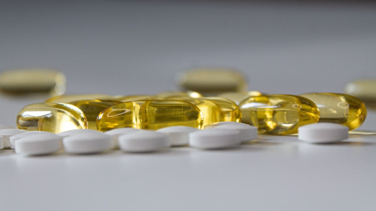 a close up of many pills on a table